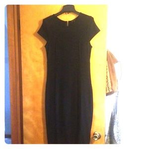 Black fitted sheath dress with zipper detail on bk